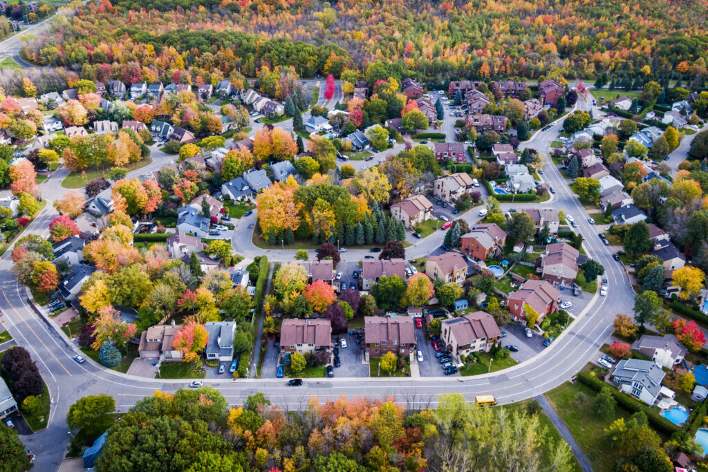 Residential neighborhood in the suburbs during autumn season, aerial view.
